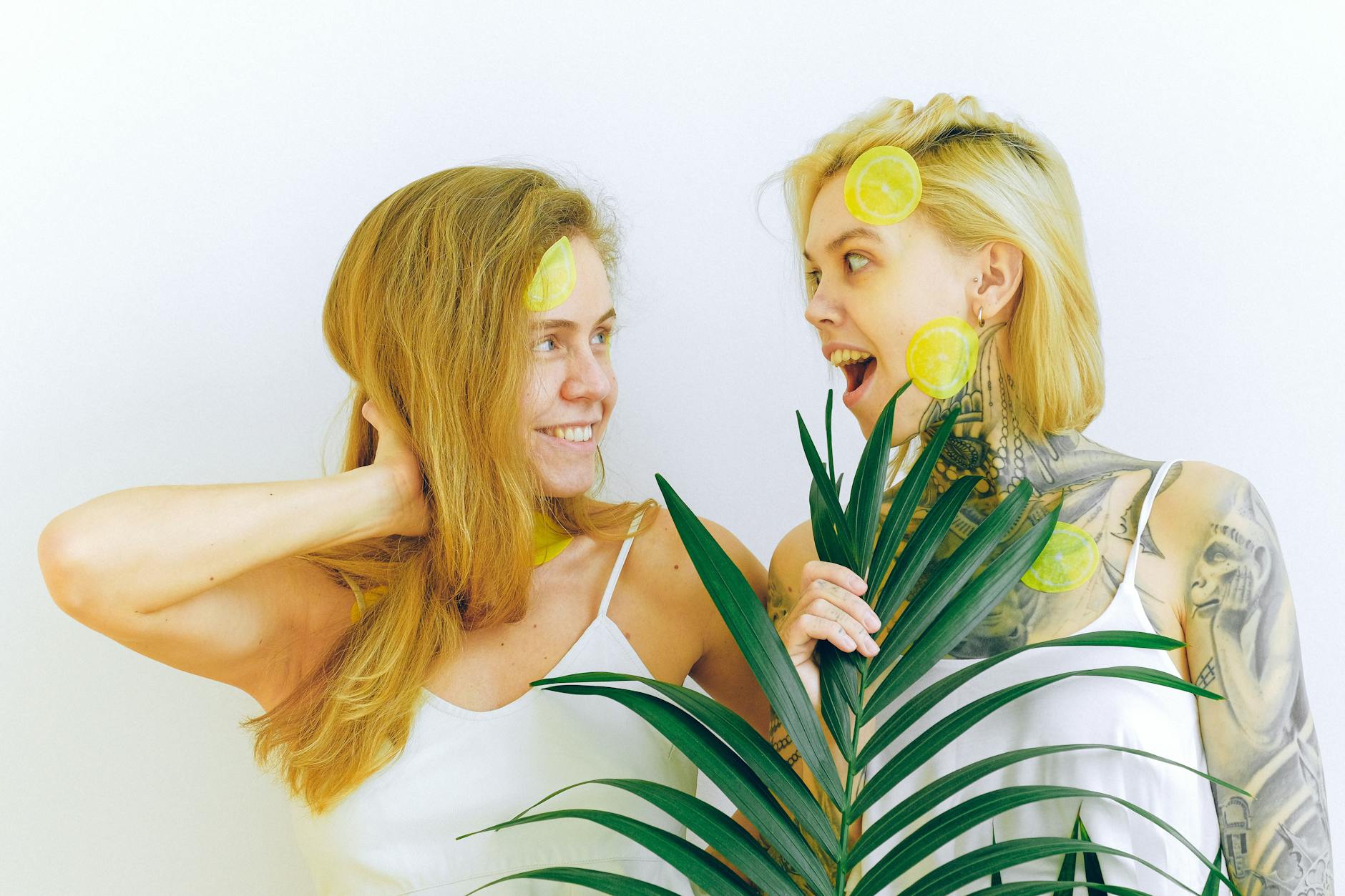 Hand holding a modern vibrator against a minimalistic backdrop