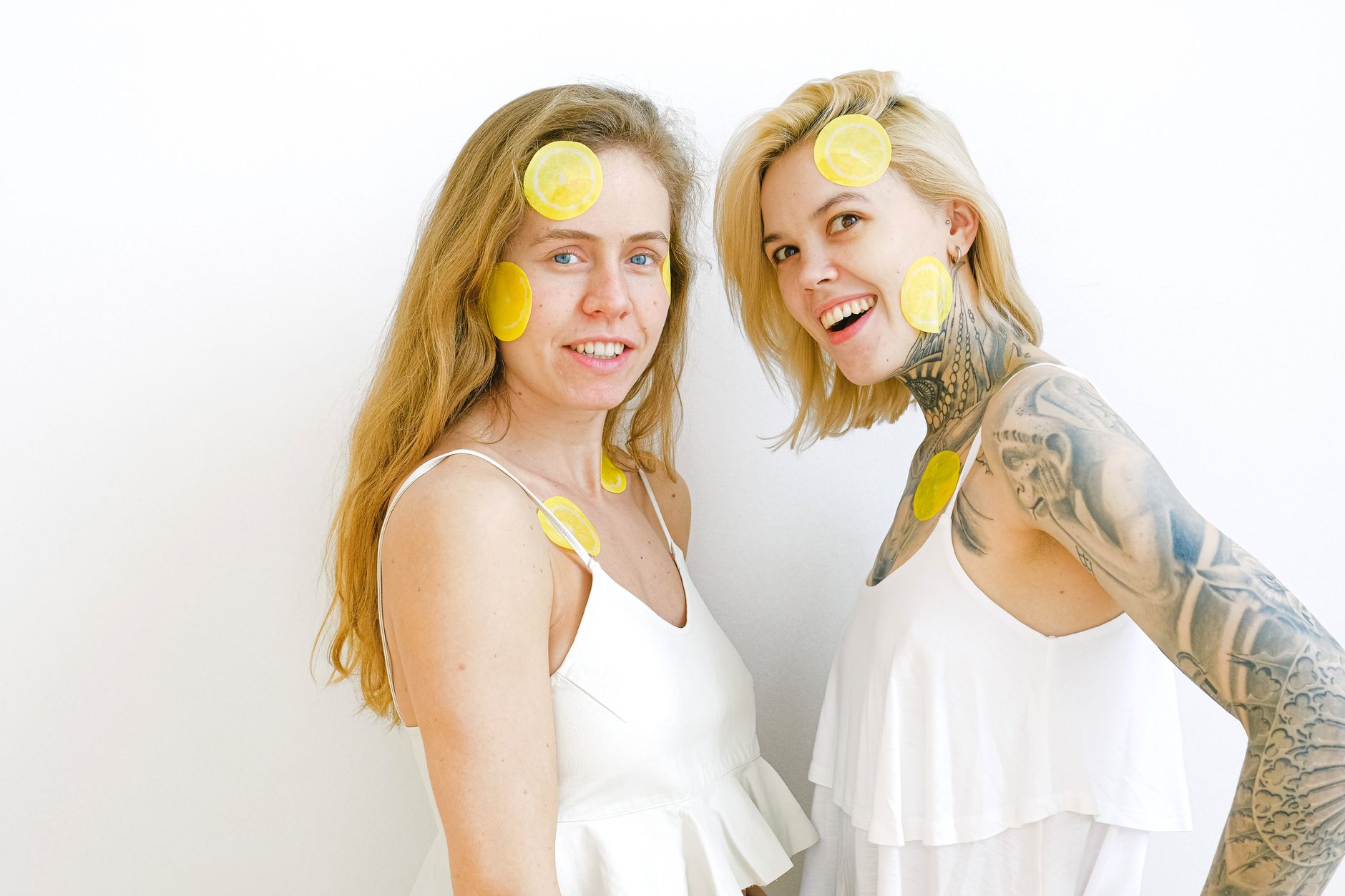Two women laughing and smiling together, symbolizing comfort and relief